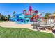 Community water park with winding slides and colorful towers, along manicured lawns at 236 Dog Leg Dr, Las Vegas, NV 89148