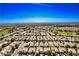 Expansive aerial view of a residential neighborhood showcasing the layout and community at 2413 Mourning Warbler Ave, North Las Vegas, NV 89084