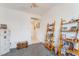 Bright bedroom featuring neutral walls, shelving, and carpeted floors at 2413 Mourning Warbler Ave, North Las Vegas, NV 89084
