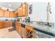 Kitchen with granite counters, stainless steel appliances, and a wine rack at 2413 Mourning Warbler Ave, North Las Vegas, NV 89084