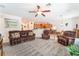 Spacious living room with comfortable seating, open to the kitchen and dining area at 2413 Mourning Warbler Ave, North Las Vegas, NV 89084