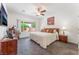 Main bedroom with a plush bed, soft carpet, dresser, and plenty of natural light at 2413 Mourning Warbler Ave, North Las Vegas, NV 89084