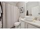 Cozy bathroom featuring a single sink, a round mirror, and a decorative shower curtain at 2425 Sturrock Dr, Henderson, NV 89044