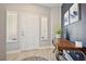 Bright foyer featuring a white door, stylish decor, and modern light fixtures at 2425 Sturrock Dr, Henderson, NV 89044