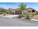 Charming single-story home featuring a landscaped front yard and a two-car garage at 2425 Sturrock Dr, Henderson, NV 89044