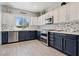 Modern kitchen with stainless steel appliances, stylish cabinets, and mosaic backsplash at 2425 Sturrock Dr, Henderson, NV 89044