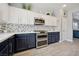 Kitchen with stainless steel oven and microwave, and two-tone cabinets at 2425 Sturrock Dr, Henderson, NV 89044