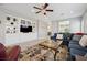 Inviting living room with built-in shelving, a plush sofa, and stylish decor at 2425 Sturrock Dr, Henderson, NV 89044