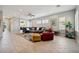 Spacious living room with tile flooring, plush seating, and lots of natural light at 2425 Sturrock Dr, Henderson, NV 89044