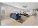 Open living room with a ceiling fan, a comfortable sofa, and neutral decor at 2425 Sturrock Dr, Henderson, NV 89044