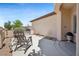 Relaxing outdoor patio with stylish chairs and well-maintained landscaping at 2425 Sturrock Dr, Henderson, NV 89044