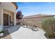 Inviting front patio with seating area and lush landscaping offering curb appeal at 2425 Sturrock Dr, Henderson, NV 89044
