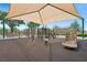 A well-equipped playground with shade canopy, slides, and climbing structures for enjoyment at 2425 Sturrock Dr, Henderson, NV 89044