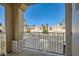 Balcony view showing the parking and other condo units with palm trees at 251 S Green Valley Pkwy # 2821, Henderson, NV 89012