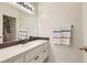Bathroom featuring a vanity with a clean white countertop, mirror and towel rack at 251 S Green Valley Pkwy # 2821, Henderson, NV 89012