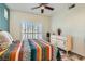 Bright bedroom featuring a decorative dresser and a ceiling fan for added comfort at 251 S Green Valley Pkwy # 2821, Henderson, NV 89012