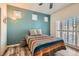 Comfortable bedroom with ample natural light, ceiling fan and wood look floors at 251 S Green Valley Pkwy # 2821, Henderson, NV 89012