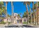 Clubhouse exterior with well-manicured landscaping and towering palm trees at 251 S Green Valley Pkwy # 2821, Henderson, NV 89012