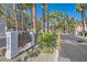 Entrance to Bella Vita community, a gated community with lush landscaping and palm trees at 251 S Green Valley Pkwy # 2821, Henderson, NV 89012