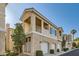Charming condo building with stucco exterior, private balconies and attached garages at 251 S Green Valley Pkwy # 2821, Henderson, NV 89012