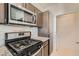 Well-equipped kitchen featuring stainless steel appliances and stylish backsplash at 251 S Green Valley Pkwy # 2821, Henderson, NV 89012