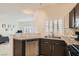 Kitchen featuring stainless steel appliances, granite countertops, and an open view to the living room at 251 S Green Valley Pkwy # 2821, Henderson, NV 89012