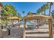 Beautiful poolside area with shade structures, tables, and seating by the pool at 251 S Green Valley Pkwy # 2821, Henderson, NV 89012