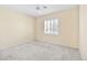 Bright bedroom with neutral paint, a ceiling fan, and a sunny window at 2538 Capella Star St, Henderson, NV 89044