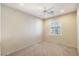 Neutral bedroom featuring carpet flooring, ceiling fan and natural light from the window at 2538 Capella Star St, Henderson, NV 89044