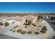 Desert-landscaped front yard with a three-car garage; mountains in background at 2538 Capella Star St, Henderson, NV 89044
