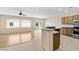 Bright, open kitchen boasts stainless steel appliances and a view to the dining and living area at 2538 Capella Star St, Henderson, NV 89044