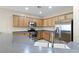 Kitchen includes stainless steel appliances, plentiful cabinet space, and breakfast bar at 2538 Capella Star St, Henderson, NV 89044