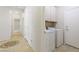 Laundry room includes washer, dryer, and storage cabinets at 2538 Capella Star St, Henderson, NV 89044