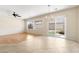 Open living and dining area filled with natural light from a sliding glass door to the yard at 2538 Capella Star St, Henderson, NV 89044
