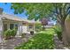 Picturesque backyard with lush lawn, mature trees, and a covered patio area, perfect for outdoor living at 2601 Harrisburg Ave, Henderson, NV 89052