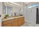 Bathroom boasts double sink vanity with granite countertops and walk-in shower at 2601 Harrisburg Ave, Henderson, NV 89052