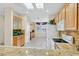 Bright kitchen with ample cabinet space, granite countertops, and stainless appliances at 2601 Harrisburg Ave, Henderson, NV 89052