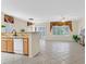 Spacious living area with tile flooring, granite counters, and lots of natural light at 2601 Harrisburg Ave, Henderson, NV 89052
