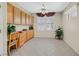 Bright office with built-in cabinets, tile floors, and plantation shutters at 2601 Harrisburg Ave, Henderson, NV 89052