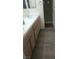 Bathroom with double sinks, wood-look flooring and separate shower at 2725 S Nellis Blvd # 1158, Las Vegas, NV 89121