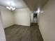 Open living room features wood floors and a laundry area at 2725 S Nellis Blvd # 1158, Las Vegas, NV 89121
