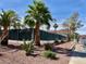 A fenced tennis court with lush desert landscaping for outdoor recreation at 2725 S Nellis Blvd # 1158, Las Vegas, NV 89121