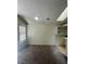 Sunlit dining area with window, carpeted floors, and direct access to kitchen at 2995 E Sunset Rd # 237, Las Vegas, NV 89120