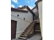 Exterior view of a two-story condo with an open stairwell and private entrance at 2995 E Sunset Rd # 237, Las Vegas, NV 89120