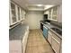 Efficient kitchen with granite countertops, modern appliances, and ample cabinet space at 2995 E Sunset Rd # 237, Las Vegas, NV 89120