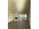 Bright living room features a fireplace and sliding glass doors to the balcony at 2995 E Sunset Rd # 237, Las Vegas, NV 89120