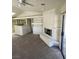 Living room with fireplace and access to kitchen and breakfast bar at 2995 E Sunset Rd # 237, Las Vegas, NV 89120
