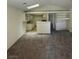 Open concept living room with carpet, combined with kitchen and breakfast bar at 2995 E Sunset Rd # 237, Las Vegas, NV 89120