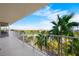 A scenic balcony view with palm trees under a blue sky overlooking the city skyline at 3111 Bel Air Dr # 7F, Las Vegas, NV 89109