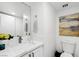Bathroom featuring a modern vanity, ample lighting, and a minimalist aesthetic at 3111 Bel Air Dr # 7F, Las Vegas, NV 89109